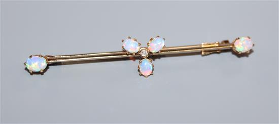 An Edwardian 15ct, white opal and diamond set cluster bar brooch, 58mm.